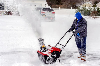 Man with umbrella on snow