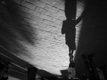 Low section of person standing on wall