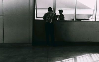 Full length of woman standing on floor