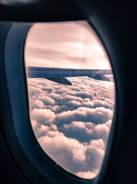 Scenic view of cloudscape seen through airplane window