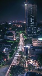 High angle view of illuminated buildings in city at night