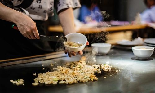 Midsection of person preparing food on table