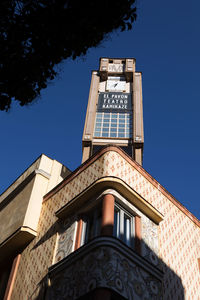 Low angle view of building against blue sky