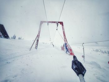 Low angle view of person on snow covered field