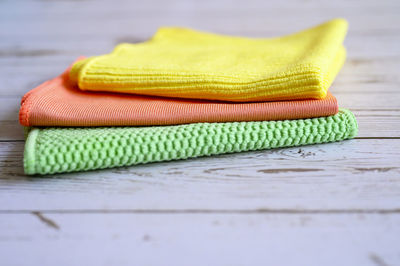 Close-up of yellow shoes on table