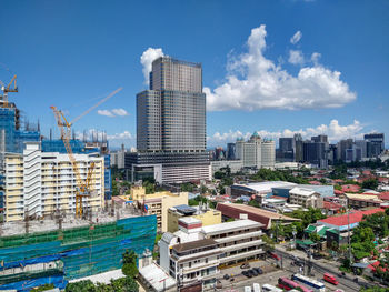 Buildings in city against sky