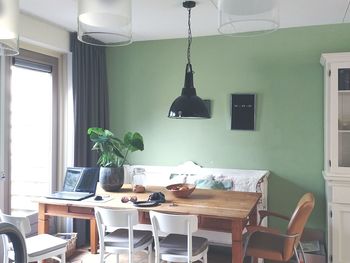 Chairs and table at home in green and white