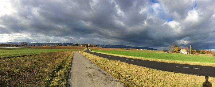 Scenic view of agricultural field against sky