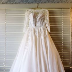 Close-up of wedding dress on wall 