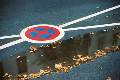 High angle view of road sign on street