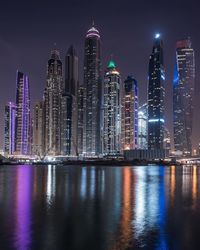 Illuminated buildings in city at night