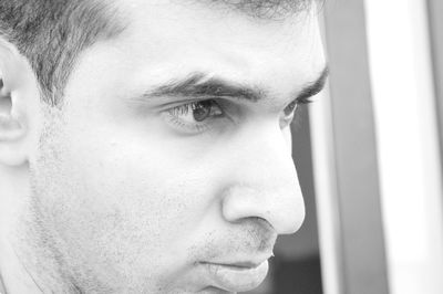 Close-up of thoughtful young man looking away