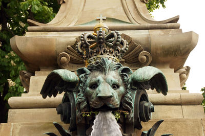 Close-up of lion shape fountain