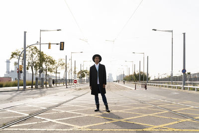 Full length of man standing on road