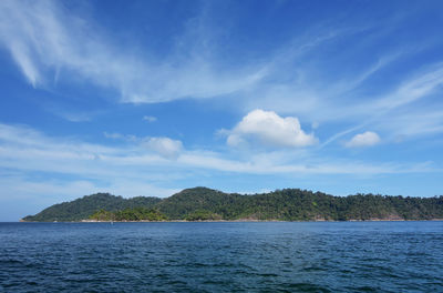 Scenic view of sea against blue sky