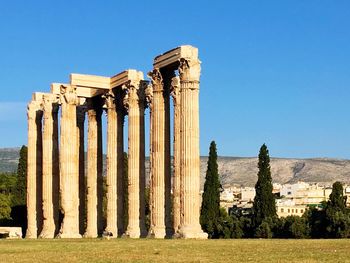 Old ruins of building against blue sky