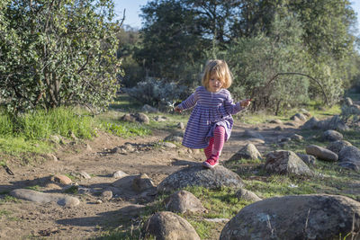 Girl walking on rocks