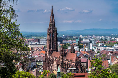 Buildings in city against sky