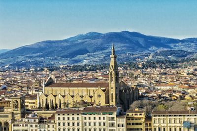 Cityscape with mountain range in background