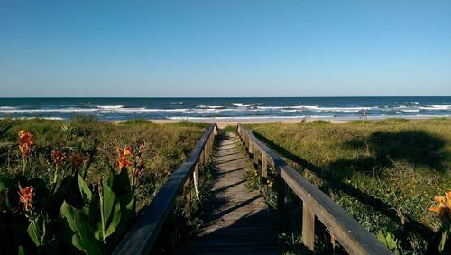 Scenic view of beach against clear sky