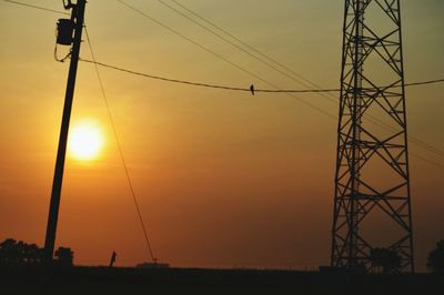 Low angle view of electricity pylon against sky