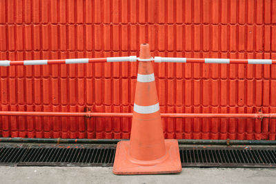 Close-up of red toy against brick wall