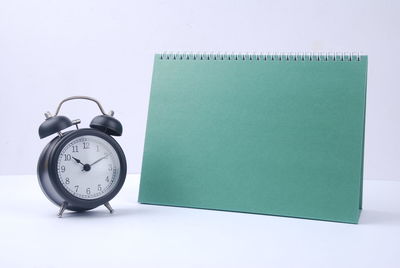 Close-up of clock on table