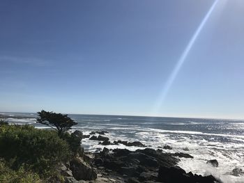 Scenic view of sea against clear blue sky