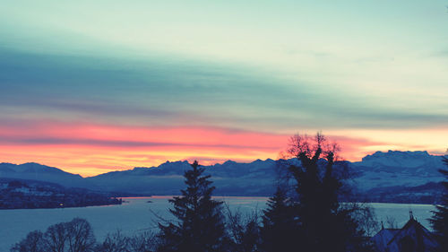 Scenic view of mountains against sky during sunset