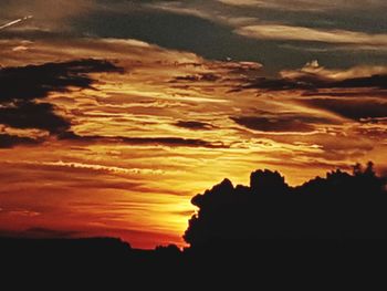 Scenic view of dramatic sky during sunset