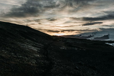 Scenic view of mountains against sky during sunset