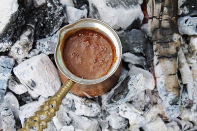 High angle view of turkish coffee being prepared on coal