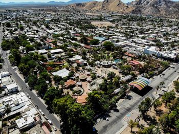 High angle view of trees and buildings in town