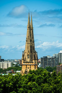 View of the spires of st mary's cathedral from sheraton grand sydney hyde park. 
