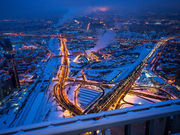 High angle view of illuminated city at night