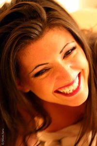 Close-up portrait of a smiling young woman