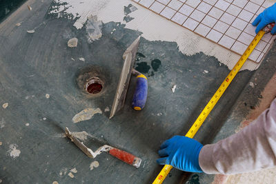 High angle view of man working on floor