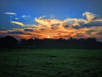 Scenic view of landscape against sky during sunset