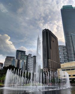 Modern buildings against sky in city