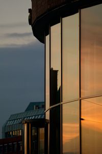 Low angle view of building against cloudy sky