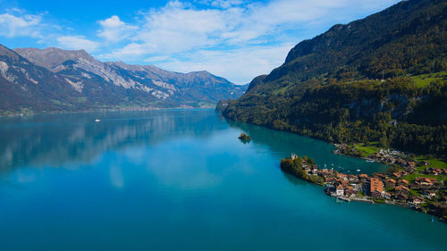 Scenic view of lake and mountains against sky