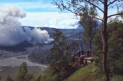 Scenic view of mountains against cloudy sky