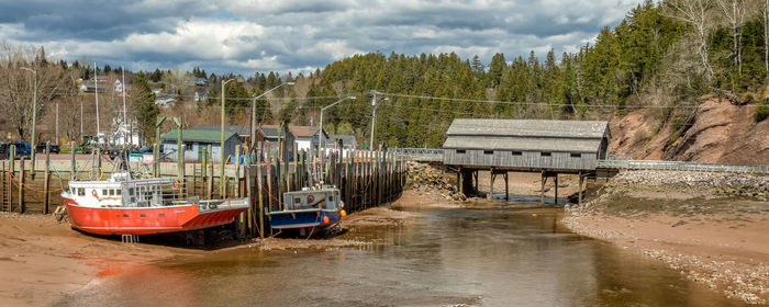 Low tide in st. martins, new brunswick, with lobster boats resting in the sand