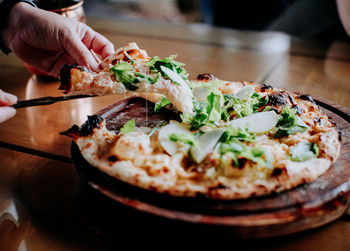 Close-up of pizza in plate on table