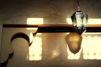 Low angle view of lit lamp