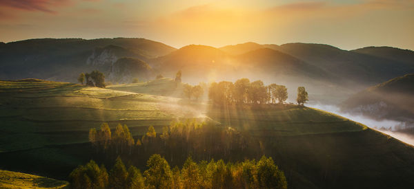 Scenic view of mountains against sky during sunset