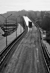 Railroad tracks against sky during foggy weather