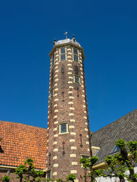 Low angle view of building against blue sky