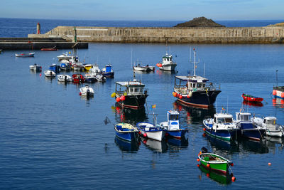 High angle view of boats moored at port