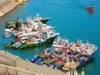 High angle view of trawlers moored on sea